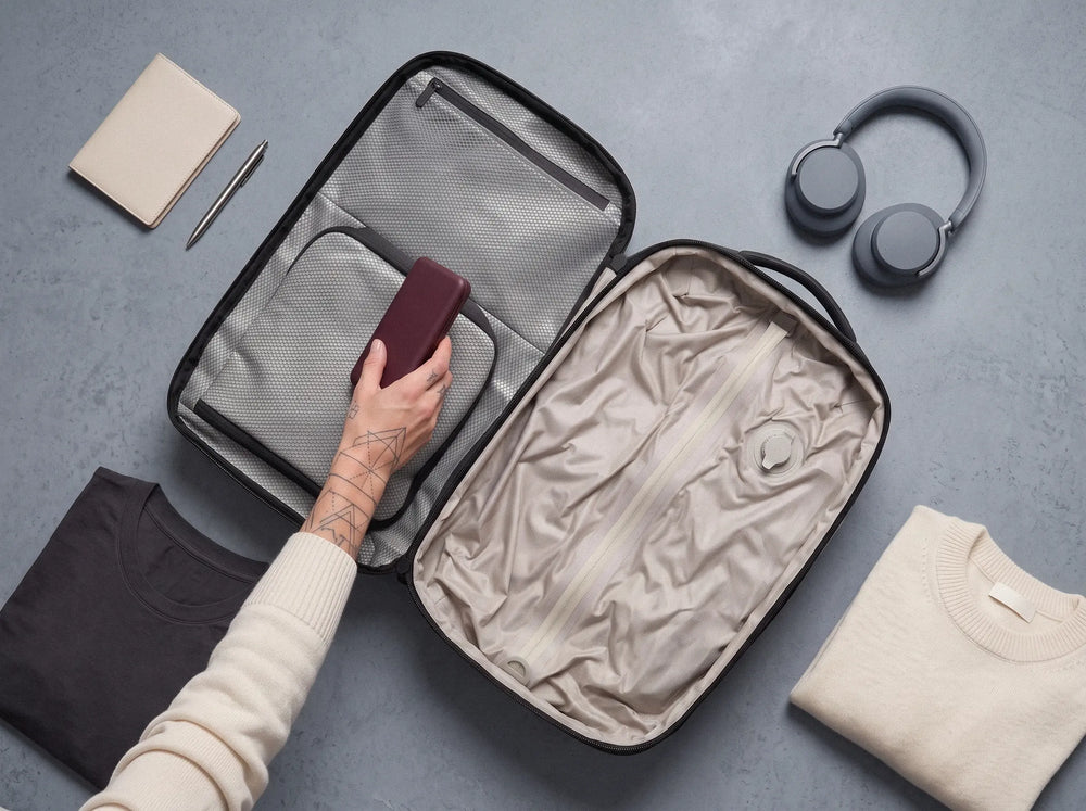 Minimalist packing scene highlighting Lavnex vacuum‑compression technology designed to reclaim space and simplify travel