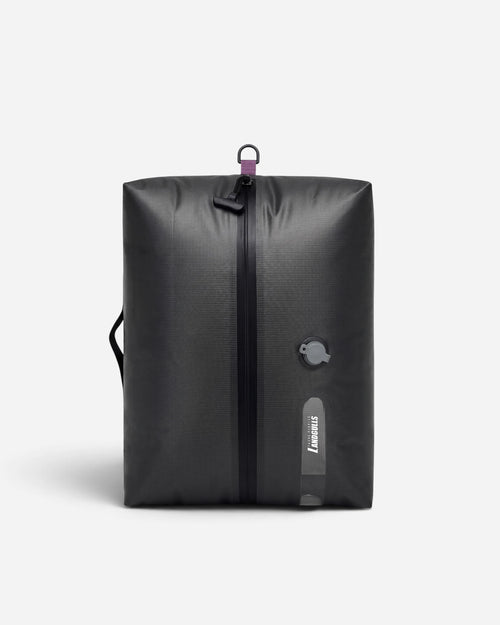 Multiple Lavnex Still Vac™ Jet Black vacuum compression bags floating against light gray background showing sleek design and modern aesthetic