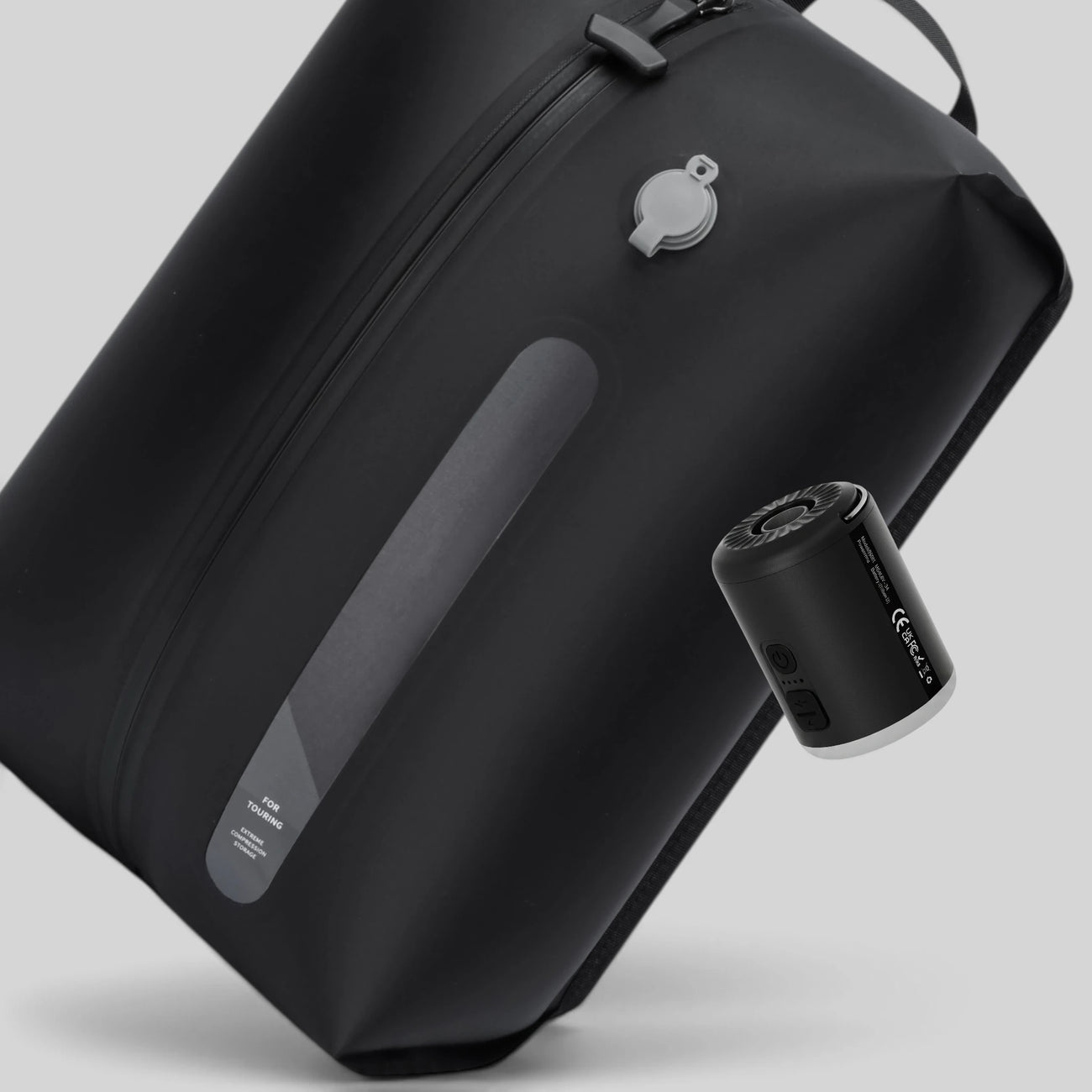 Lavnex Still Vac™ Jet Black vacuum compression bag shown with VoxAir Pro™ portable air pump highlighting smart compression system design