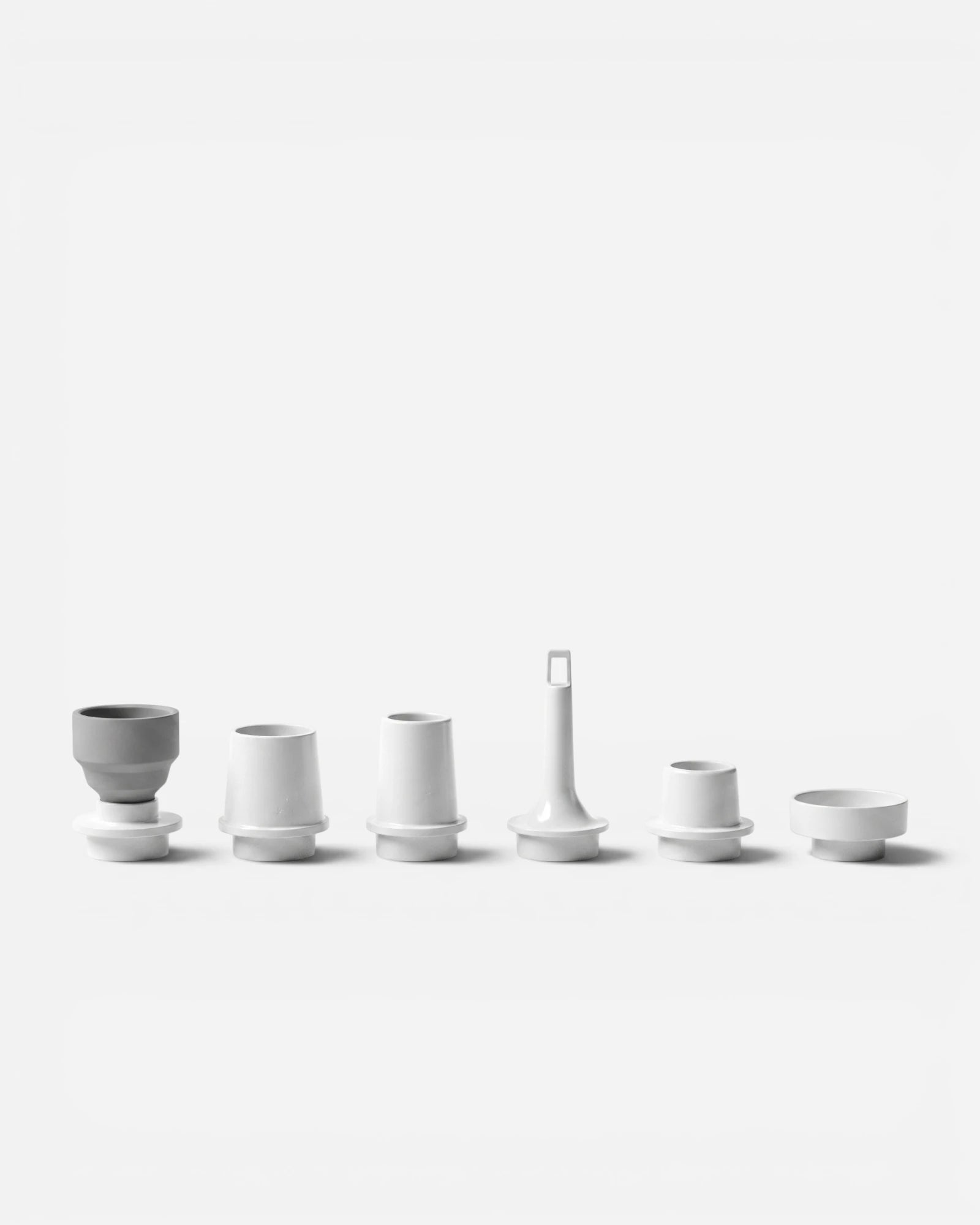 Set of six Arctic White nozzles for Lavnex VoxAir Pro™ portable air pump arranged in a row on light background