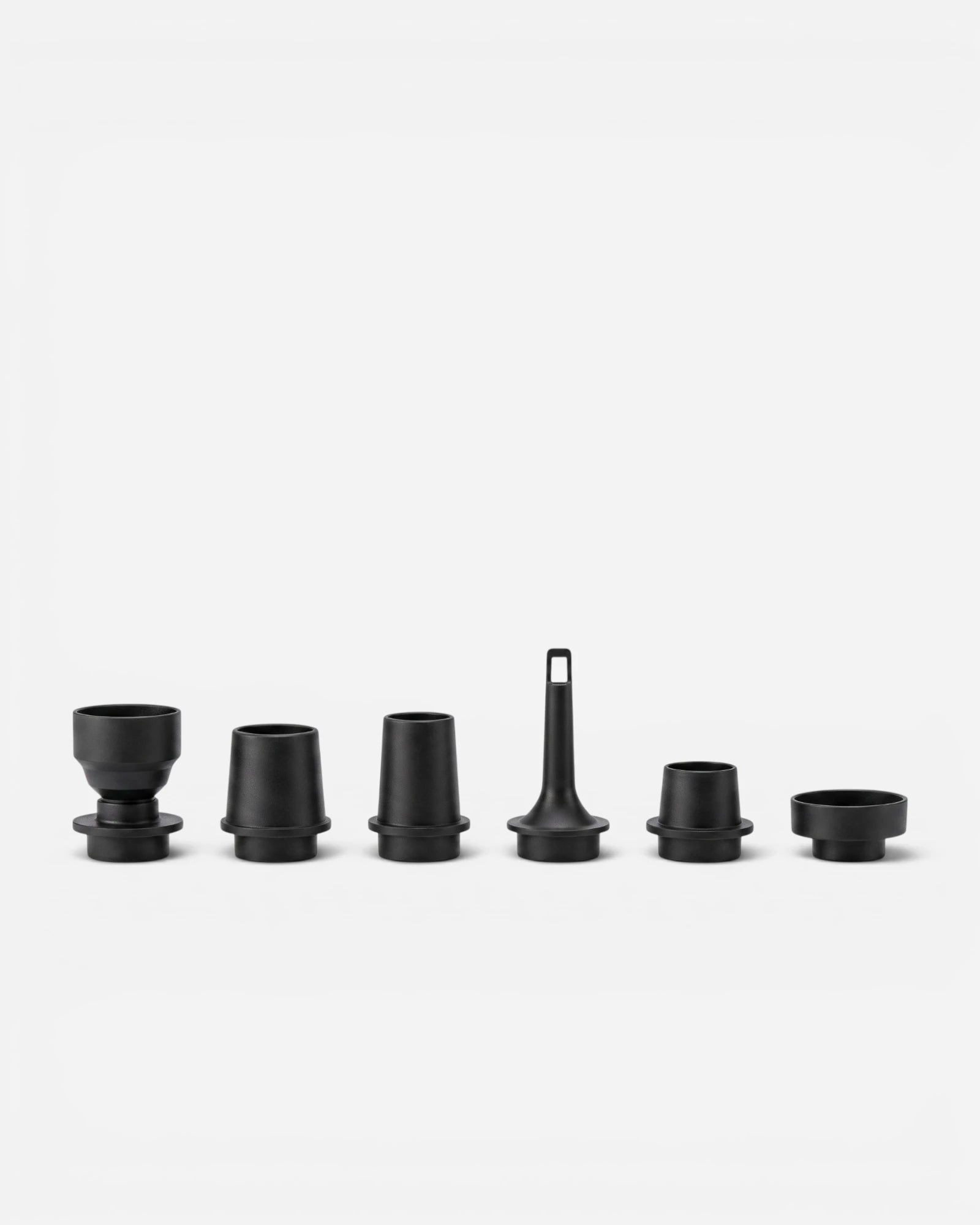 Set of six Jet Black nozzles for Lavnex VoxAir Pro™ portable air pump arranged in a row on light background