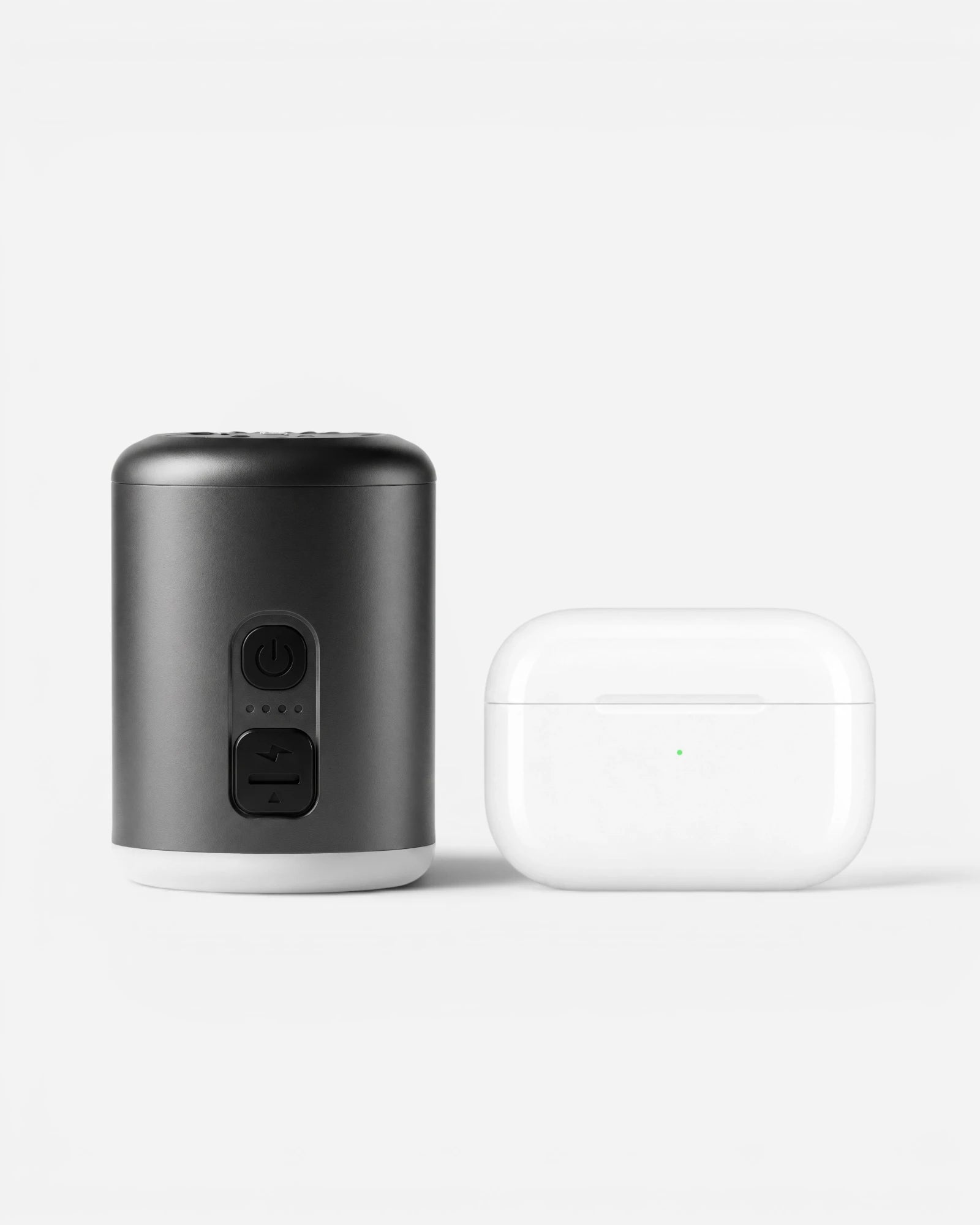 Lavnex VoxAir Pro™  portable air pump placed beside white wireless earbuds case showing compact size