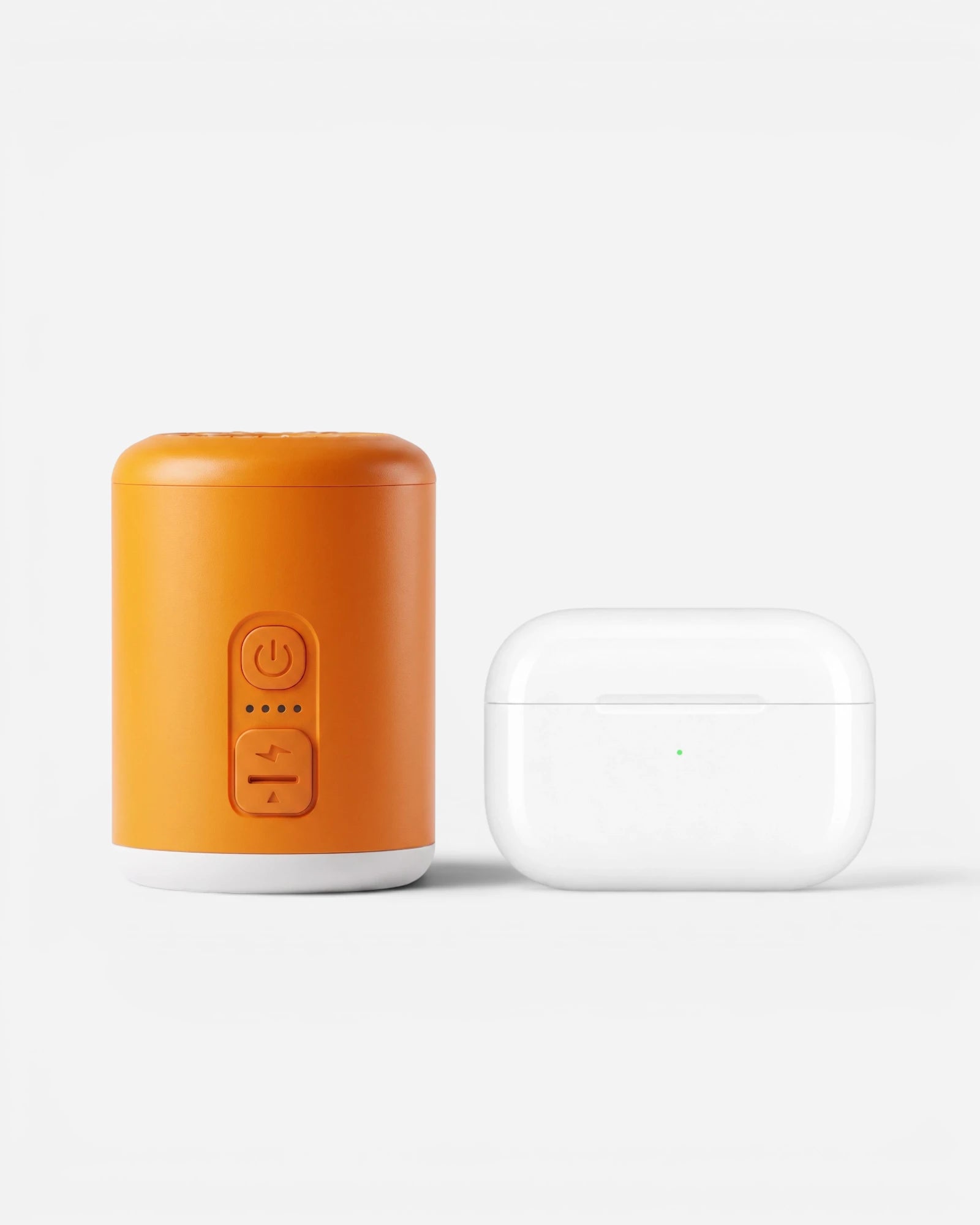 Lavnex VoxAir Pro™  portable air pump placed beside white wireless earbuds case showing compact size