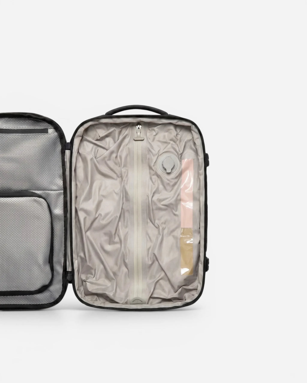 Interior view of Lavnex ZoraPack Mini™ backpack showing compression compartment and valve system