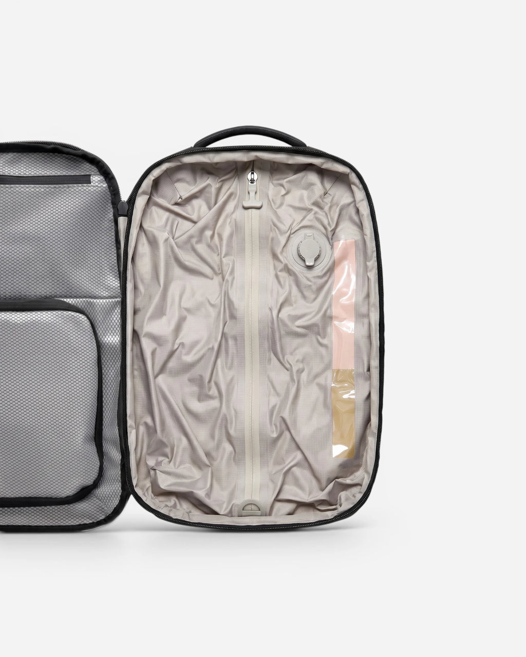 Interior view of Lavnex ZoraPack Pro backpack showing compression compartment and valve system