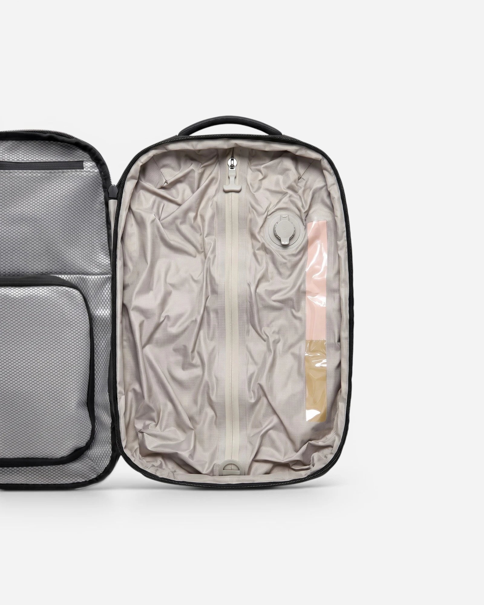 Interior view of Lavnex ZoraPack Pro backpack showing compression compartment and valve system