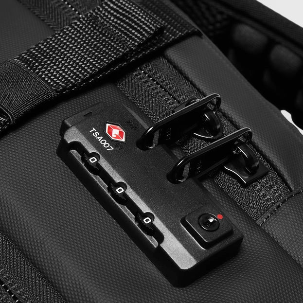 Close-up of a black suitcase with TSA lock mechanism